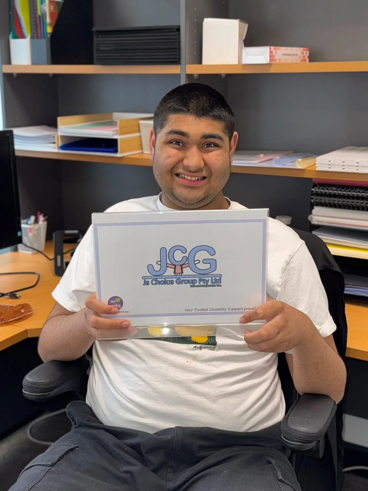 JS Choice participant holding a JS Choice Group sign